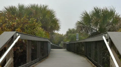 Stormy beach boardwalk, 4K Stock Footage 47947611