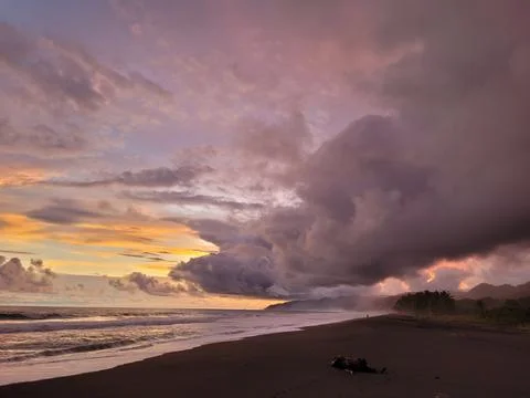 Stormy beach sunset Stock Photos