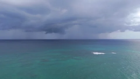 Stormy clouds on the background over crystal clear Caribbean Sea water
Aerial Stock Footage 325687206