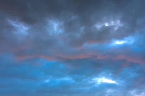 Stormy clouds in dramatic sky Stock Photos