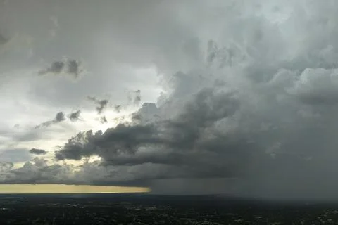 Stormy clouds forming during thunderstorm on dark sky. Moving and changing .. Stock Photos