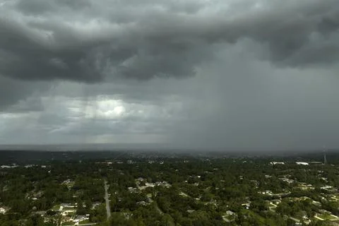 Stormy clouds forming during thunderstorm on dark sky. Moving and changing Stock Photos
