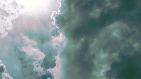 Stormy clouds moving through sky with sun rays filtering through, dynamic w.. Stock Footage 346243747