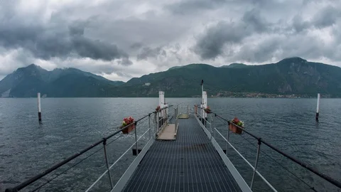 Stormy clouds over dock in Como Lake Stock Footage 129592195