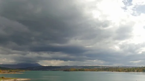 Stormy clouds over lake Stock Footage 80998172