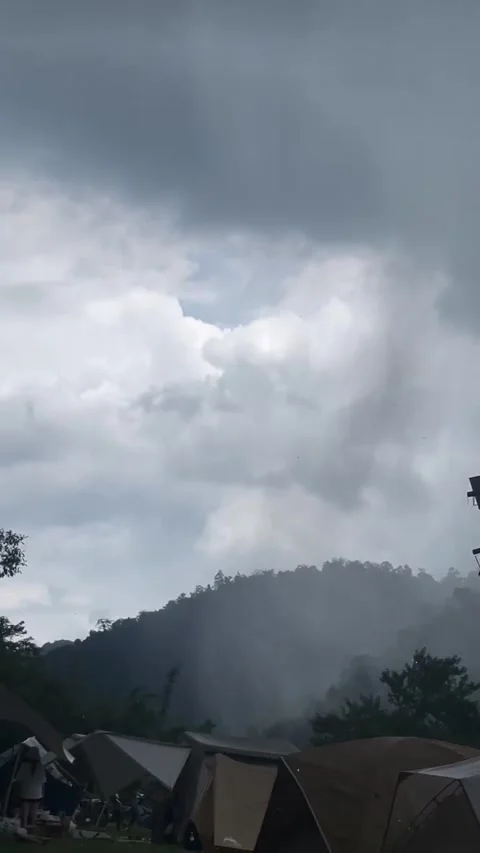 Stormy Clouds Over Mountain Campground and Tents Video stock 341317580