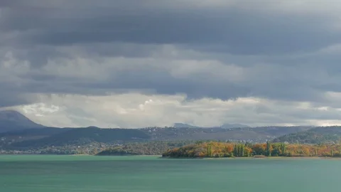 Stormy clouds over mountain lake of turquoise color Stock Footage 80997889