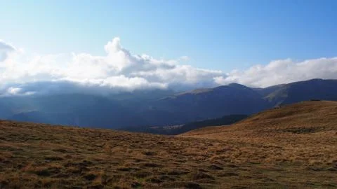 Stormy clouds over mountains Stock Photos