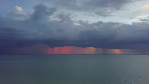 Stormy Clouds with Rain over the Sea at Sunset. Seascape with Thunderclouds Stock Footage 111963030