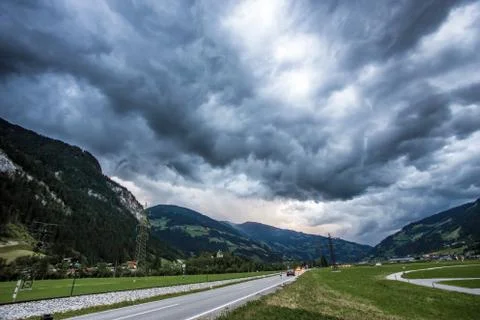Stormy clouds with the road Stock Photos