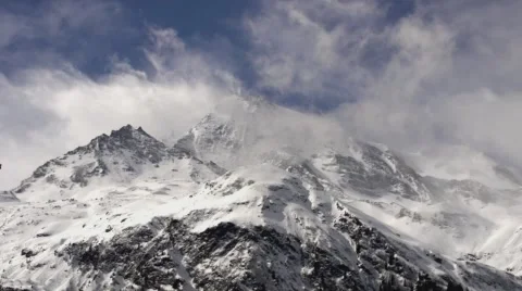 Stormy Clouds Roll Over Snow Capped Mountains and Glaciers. Vídeo Stock 59162297