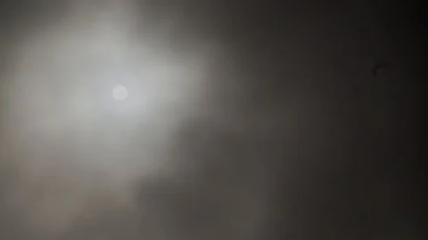 Stormy clouds rolling in front of the Sun on a gloomy day Vidéo 111396772