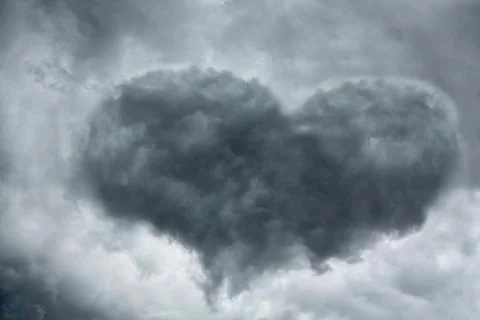 Stormy clouds in the shape of heart Stock Photos