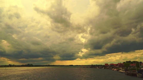 Stormy clouds at sunset over the Kerteminde fjord Stock Footage 161760425