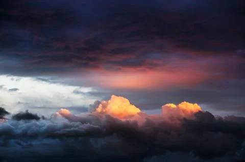 Stormy clouds at sunset Stock Photos