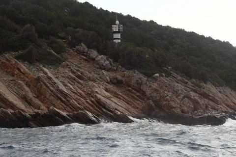 Stormy cloudy day. Dramatic sky and huge waves at the Lighthouse Stock Photos