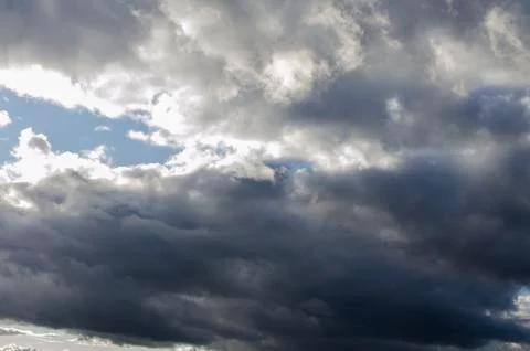 Stormy cloudy sky dramatic dangerous dark gray cloudscape Stock Photos