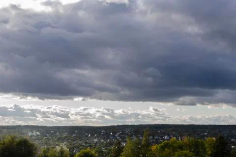 Stormy cloudy sky dramatic dangerous dark gray cloudscape Stock Photos