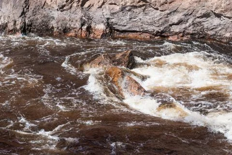 Stormy current of a river Stock Photos
