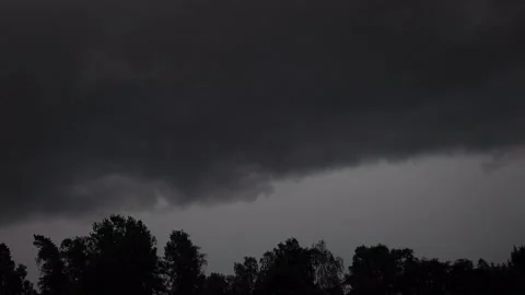 Stormy dark clouds during thunder storm with ligtning in sweden Stock Footage 135032650