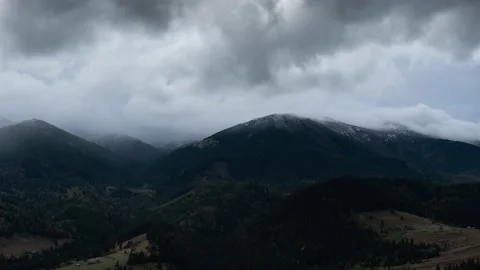 Stormy dark winter clouds mountain landscape timelapse Stock Footage 145578296
