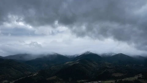 Stormy dark winter clouds mountain landscape timelapse Stock Footage 145578313