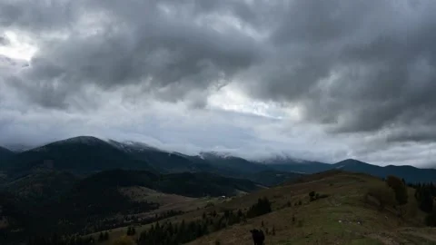 Stormy dark winter clouds mountain landscape timelapse Stock Footage 145578336