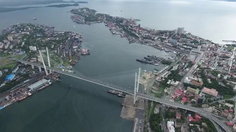 Stormy dramatic sky Golden Bridge Zolotoy horn Vladivostok Russia Aerial 4k      Stock Footage 75740760