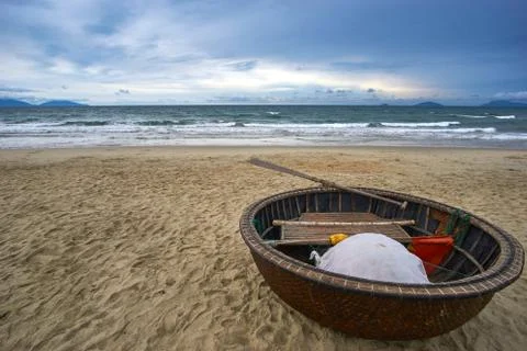 Stormy evening at the beach with dramatic clouds and waves. Traditional Stock Photos