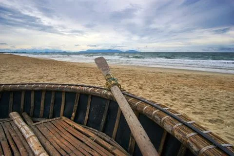 Stormy evening at the beach with dramatic clouds and waves. Traditional Stock Photos