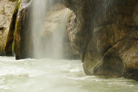 A stormy falling waterfall with splashes in the Chegem gorge Stock Photos