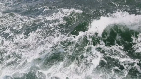 Stormy foamy waves splash at sailing ship side close view Stock Footage 148388788