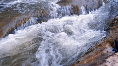 A stormy mountain river flows between stone boulders. The concept of ecology Stock Footage 195837454