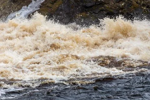 Stormy mountain river with large waves Stock Photos