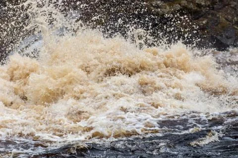 Stormy mountain river with large waves Stock Photos