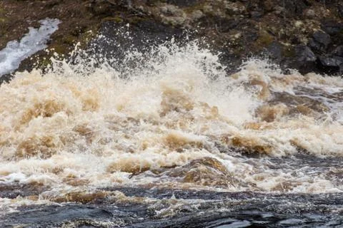 Stormy mountain river with large waves Stock Photos