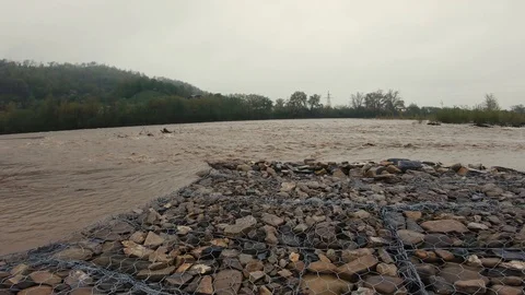 Stormy mud streams of a mountain river, after the rains Stock Footage 107534564