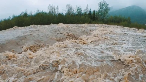Stormy mud streams of a mountain river, after the rains Stock Footage 107559606