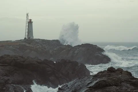 Stormy ocean and beacon landscape photo Stock-Fotos
