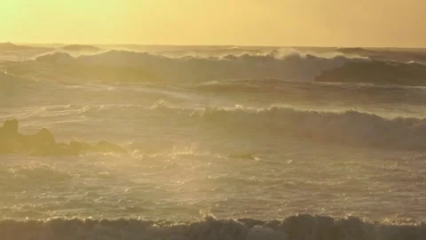 Stormy Ocean Waves Crash Onto Rugged Coastline After a Storm at Sunset Stock Footage 341684001