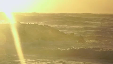Stormy Ocean Waves Crash at Sunset: Powerful Surf on a Cloudy Beach Video stock 288686648