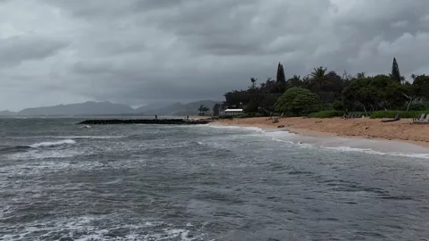 Stormy ocean waves rolling toward a Kauai beach 動画素材 348731478