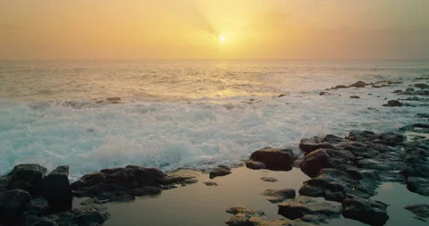 Stormy Pacific ocean waves breaking on wet sea cliffs rocks with white splashes Stock Footage 233223197