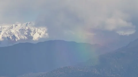 Stormy Rainbow on Cloudy Distant Mountains Stock Footage 8836522