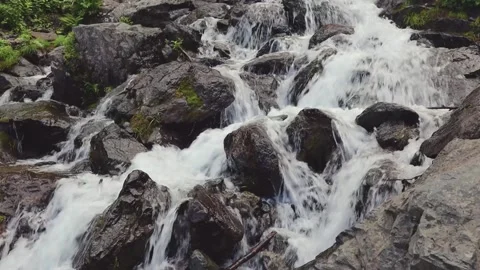 Stormy river flowing over big rocks in summer time. Stock Footage 190604993
