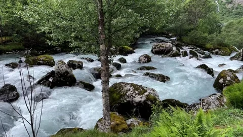 A stormy river flows over rocks Stock Footage 337364965