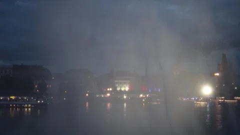 Stormy riverside city at night Stock Footage 335919945