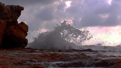 Stormy sea with high waves rolling against the rocky coast. Stock Footage 135350876