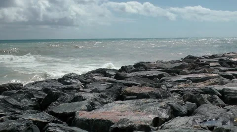 Stormy sea waves rocks breakers froth clouds Stock Footage 48624604