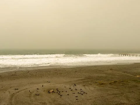 Stormy sea waves under dramatic dusty sky on Mediterranean coast Stock Photos